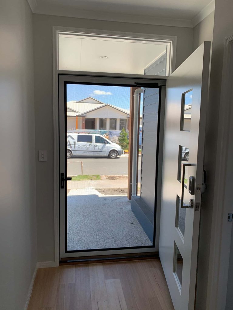 White Invisi-Gard Security Screen for the front door, installed by Alpha Screens & Glass on the Sunshine Coast