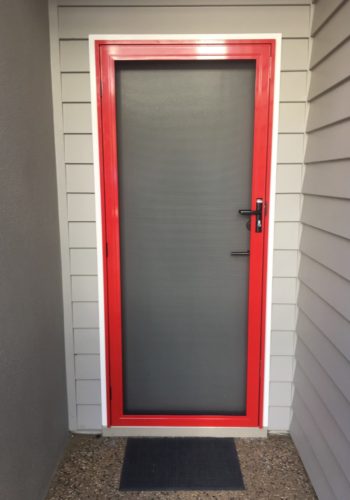 Red 316 Stainless Steel Security Hinged Door supplied and installed by Alpha Screens & Glass on the Sunshine Coast QLD