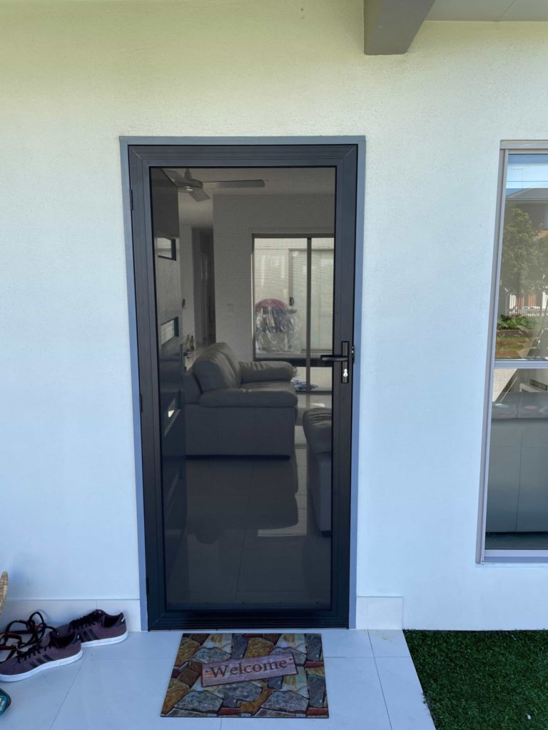 Black Hinged Security Screen door in a Sunshine Coast home