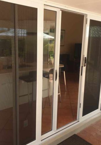 Pearl White Sliding security Screen door supplied and installed by Alpha Screens and Glass on the Sunshine Coast, QLD