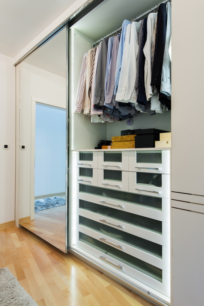 Wardrobe with Clothes Hanging on the Top