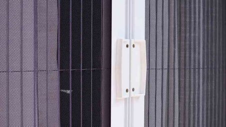 Security Screen With White Curtains Inside